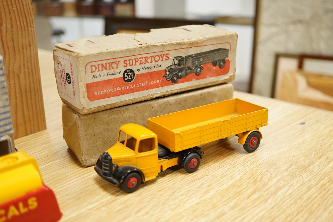 Five boxed Dinky Toys and Supertoys; Bedford Articulated Lorry in yellow (521), Leyland Cement Wagon (933), AEC tanker (991), Plymouth USA taxi (265) and Marrel Multi-Bucket Unit (966)